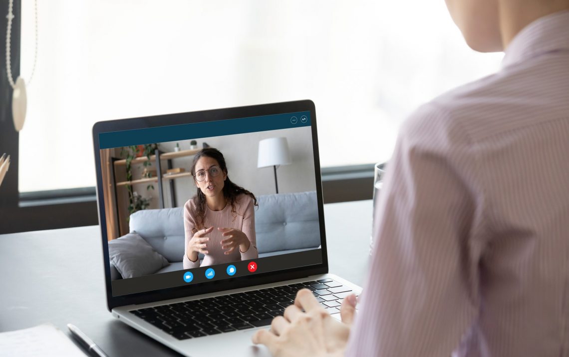 Businesswoman Having Distant Negotiations Using Video Conference